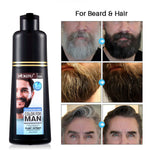 The man has a mustache, needs hair washing, and is experiencing hair loss.